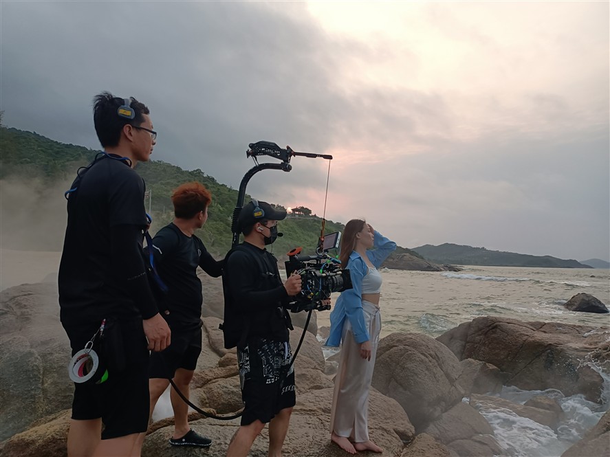 Qingdao production crew reviewing a shoot on location